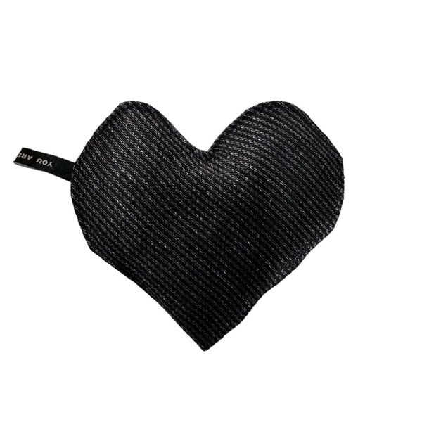 Small heart-shaped warming pillow in blackgrey