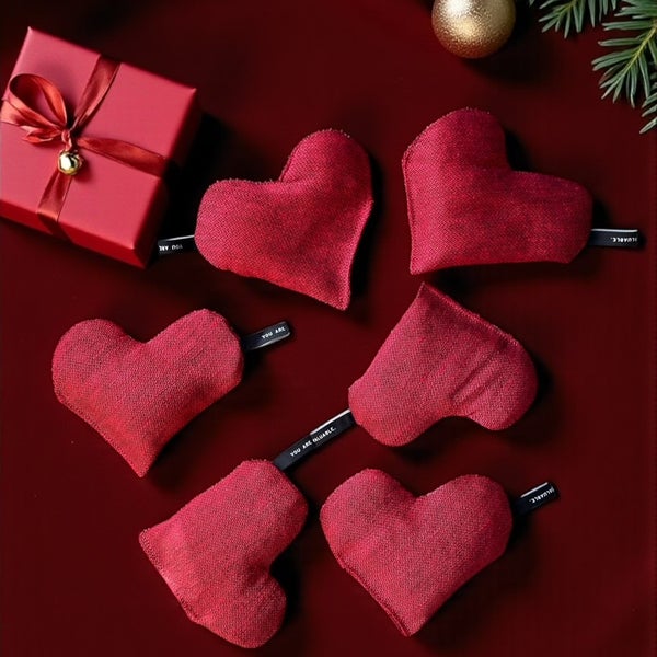 Small heart-shaped warming pillow in red