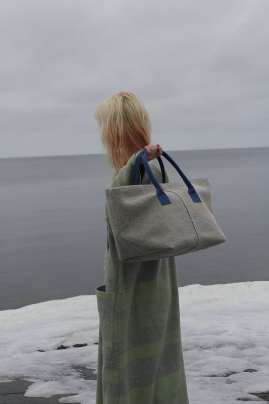 Homevideos bag in white with blue handles